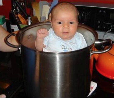 Baby Takes a Warm Bath in a Pot of Boiling Water on the Stove