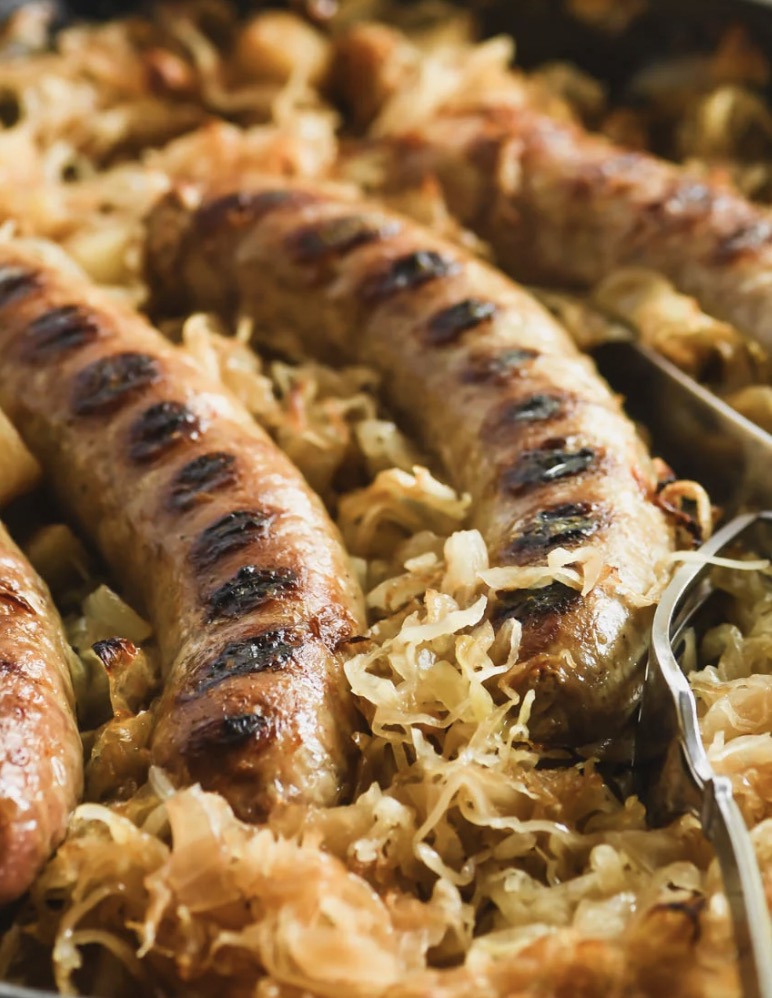 Baked Brats with Caramelized Sauerkraut - Faxo