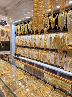 gold chain necklace and wrist watch