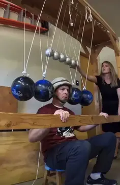 Newton's Cradle With Human Head